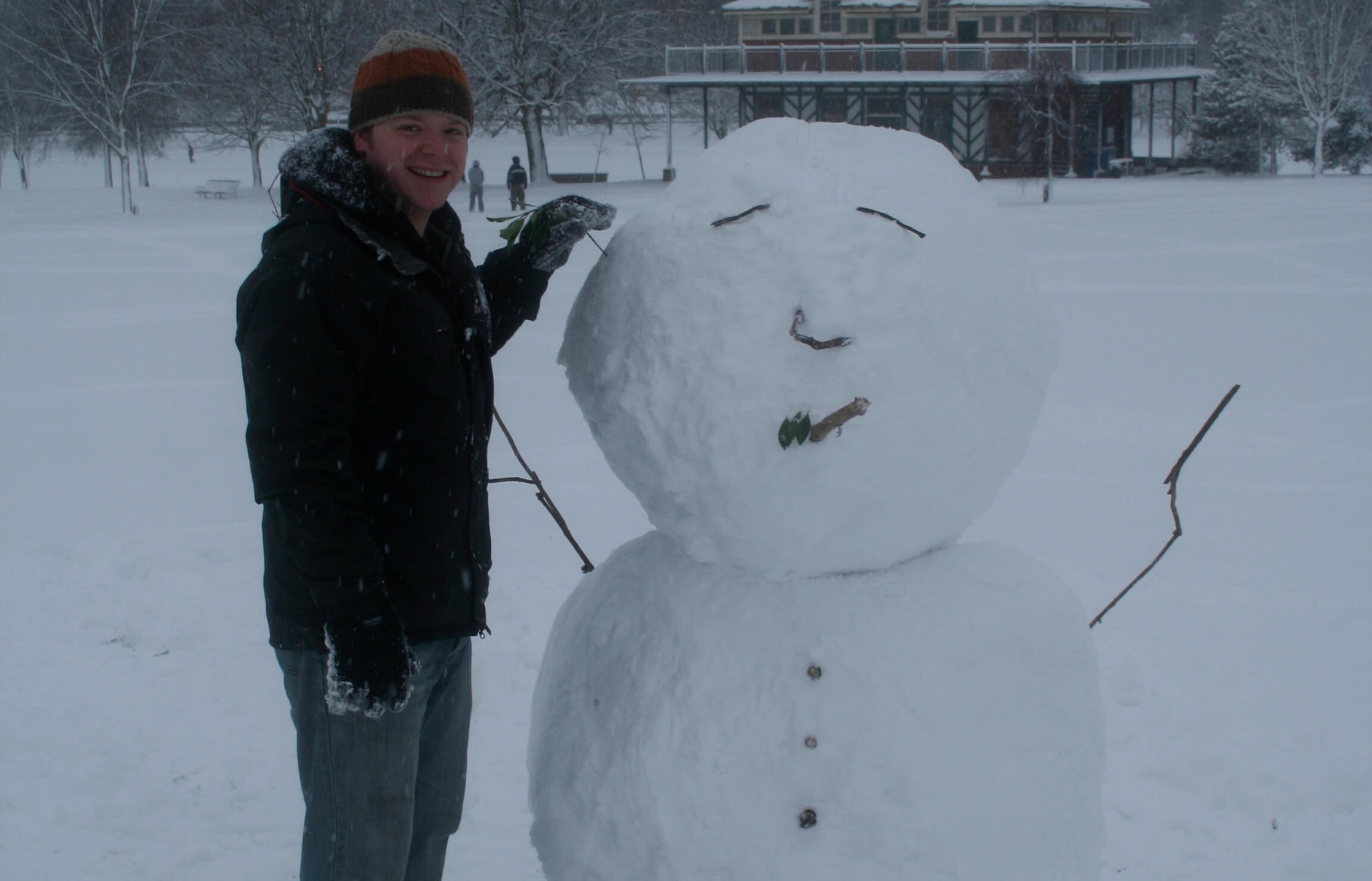 A particularly young looking Remy besides the head-heavy snowman, whom randomly smokes a cigar